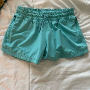 Athleta teal girl shorts with side pockets